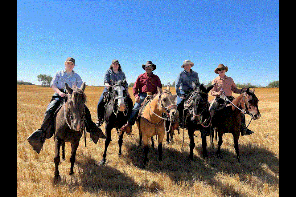 From left, Gina, Jillian and Russell Bayliss, Kathy Kyle and Morgan Bayliss love to ride the cattle drives as a family. 