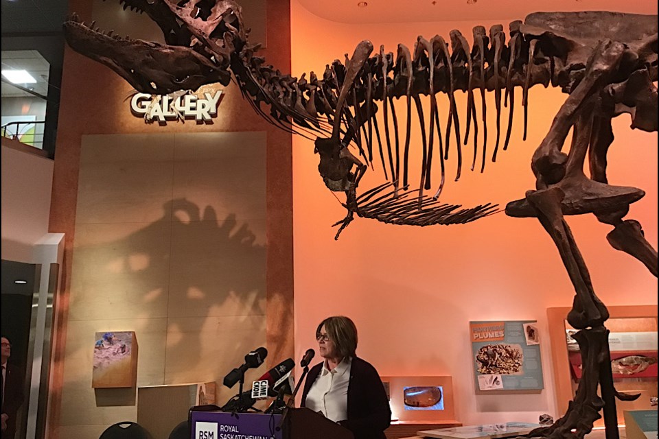 Minister of Parks, Culture and Sport Alana Ross speaks at Royal Saskatchewan Museum underneath the museum’s star attraction Scotty the T-Rex.