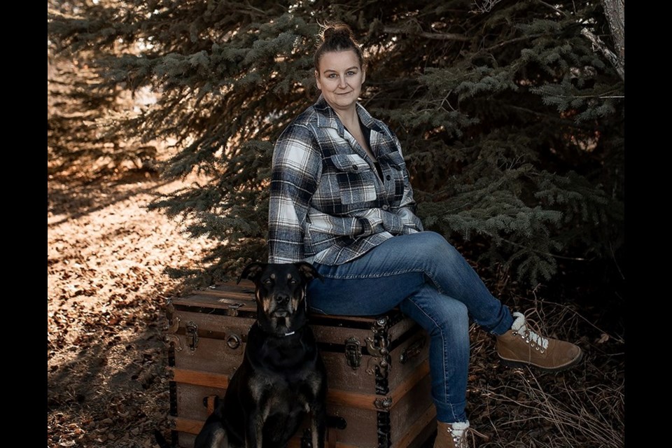 Unity businesswoman, Shannon Heitt with dog Ember, still wanted to work with animals after her retail pet supplies store was forced to close.