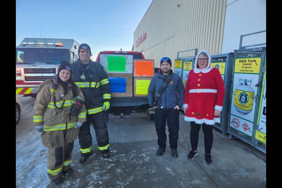 Bridget Thimsen, right, donated over 350 crocheted items to the Angel Tree program during the Estevan fire department's toy drive. 