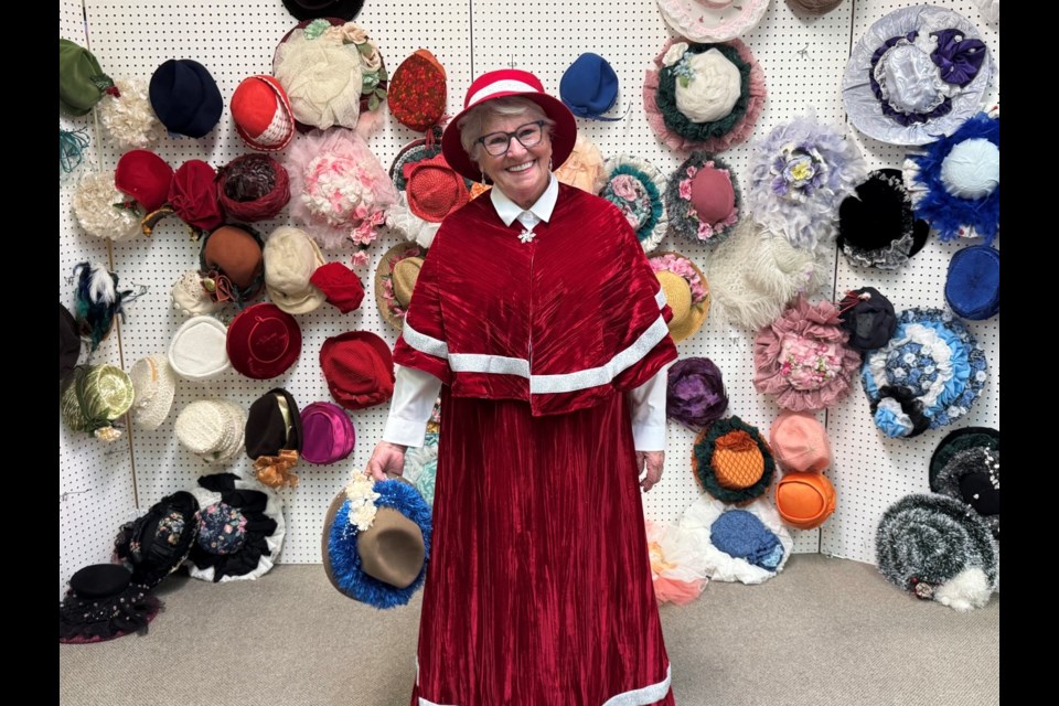 Bev Thompson proudly displayed the Victorian hats that Irene Doty gave her before Doty died to keep the Dickens tradition going. 