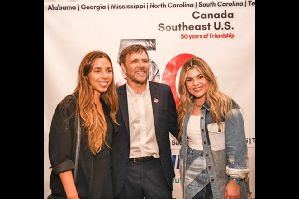 Diplomat James Hill, centre, the Consul General in Atlanta, Ga., is with Brooklyn and Tenille Arts, as Tenille performed at a celebration of 50 years of Canada having a presence in the U.S. 鶹ýAVeast region.