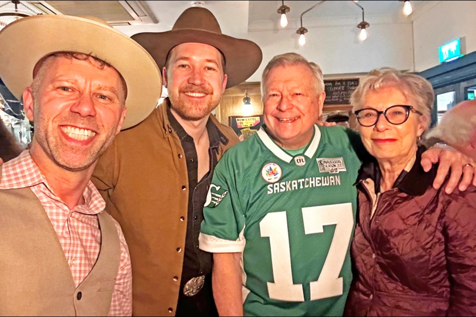 Singer Jeffery Straker, along with his guitarist Bryn Besse, posed with the High Commissioner to the UK, Ralph Goodale and his wife Pam, who was decked out in Rider gear at Straker's London show on Wednesday night.