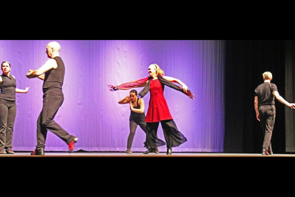 Marina Nemat, centre in red, danced with the members of the MOTUS O Dance Theatre in the opening of the dramatic presentation of "Prisoner of Tehran" on Wednesday evening.