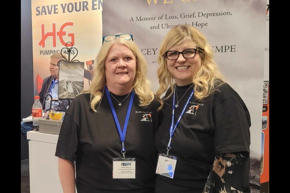 Stacey Grimes Wempe, right, with her friend Trina Whelan promoting the book. 