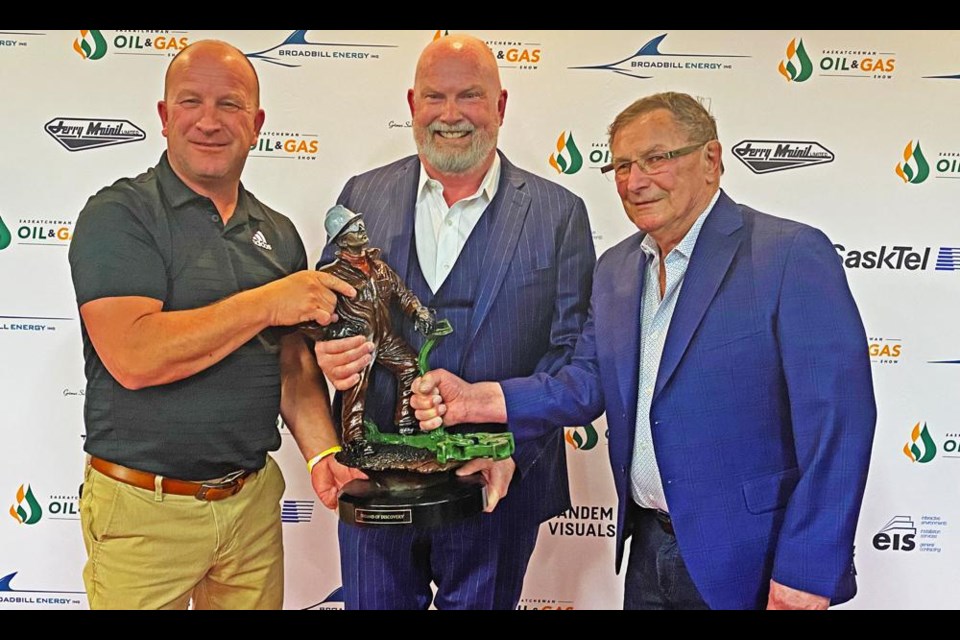 Del Mondor, centre, owner of Aldon Oils, is flanked by his brother Kerwin and father Norm, as he held the Sask Oil Person of the Year Award presented at the Saskatchewan Oil and Gas Show in June.