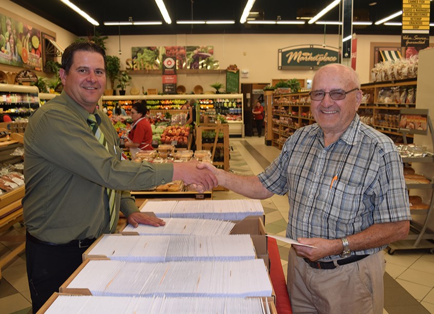 At Co-op Equity Days on June 7, Orest Lewchuk (right) received his equity cheque from Gateway Co-op General Manager Brad Chambers at the Food Store in Canora. In total, over $1 million was to be distributed in equity and cash, with all Gateway Co-op members receiving 30 per cent of their allocation in cash.