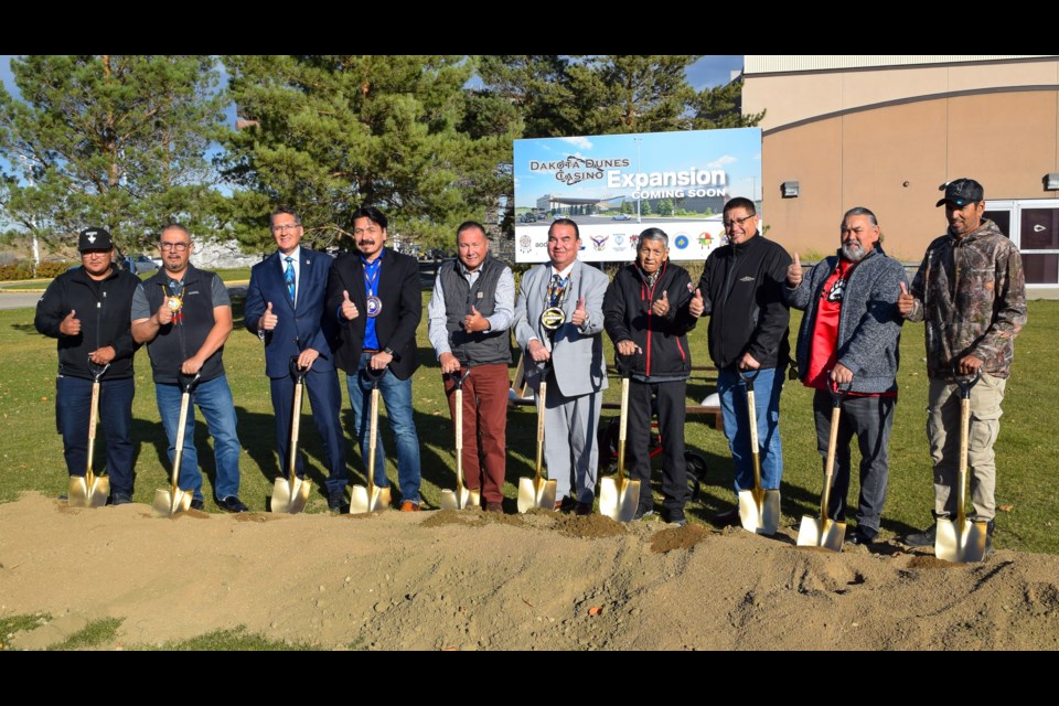 Saskatchewan Indian Gaming Association President and CEO Zane Hansen, third left, Whitecap Dakota First Nation Chief Darcy Bear, fourth left, and Saskatoon Tribal Council Chief Mark Arcand, third right, led the sod-turning ceremony.