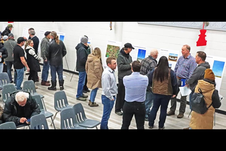 Information boards were set up by Enbridge to describe the revised plans for the wind turbine project, and a number of representatives were on hand to answer questions prior to the public open meeting at McKenna Hall on Thursday.