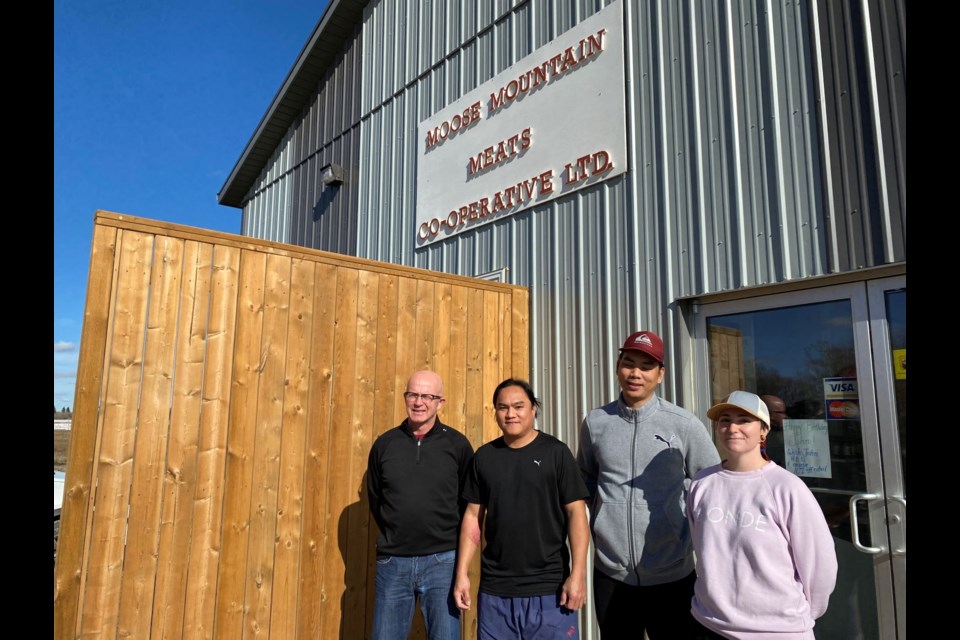 Pictured from left, butchers Brent Wilson, John Trinidad and Jason Barnachea, and employee Nikki Moreau. 