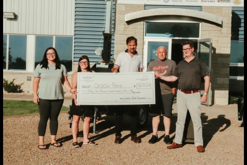 From left, Beth Lischynski, Oxbow Agencies Ltd (gold sponsor of the event); Megan Wright, rink board representative; Kaleem Ahmed, CFO, Saskarc Group; Heath Mathison, Red Hawk Well Servicing Inc. (gold sponsor of the event); and Brent Scott, CEO, Saskarc Group, partook in a cheque presentation that brought the Oxbow rink ice plant campaign $60,000 closer to its goal. 