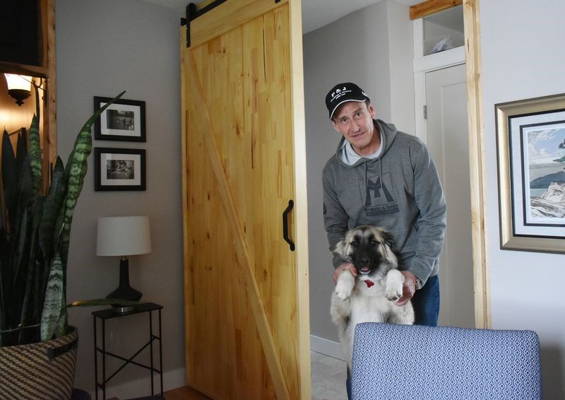 Steve Collett posed with his six-month-old puppy, Mystic, in front of the custom-made sliding door he crafted in his newly renovated Kamsack home. Collett has launched a brand new Kamsack company called SWC Property Services – a business that aims to provide residents with virtually any type of home improvement service.