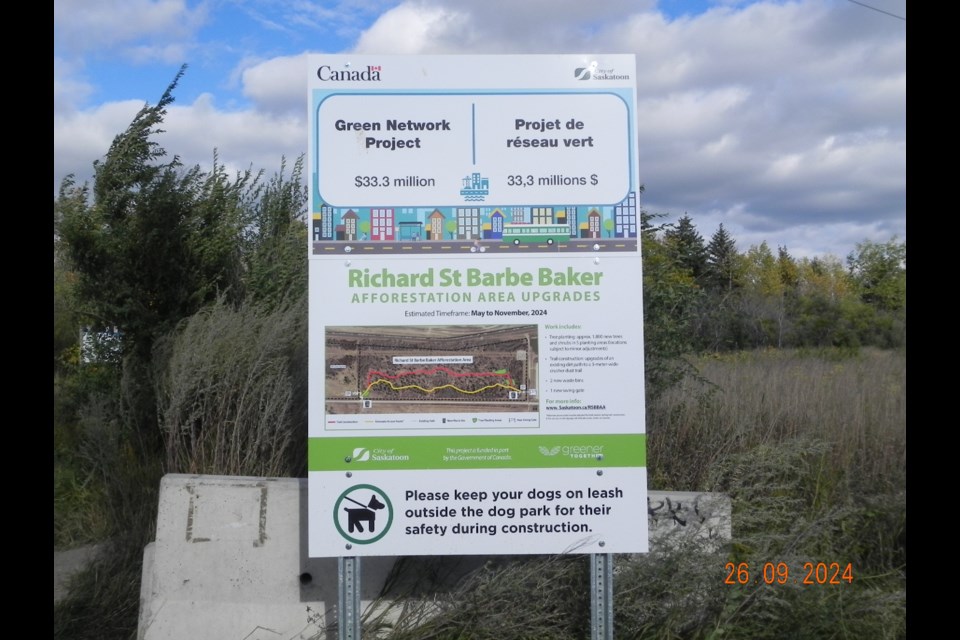 A sign near the entry of the Richard St. Barbe Baker Afforestation Area outdoor recreation venue outlines the infrastructure enhancements coming to the green space in Saskatoon.                               