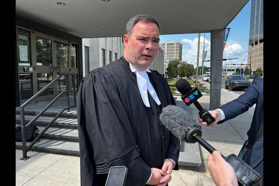 Senior Crown prosecutor Derek Davidson meets with reporters outside Regina Court of King's Bench after the Cyr decision was delivered.