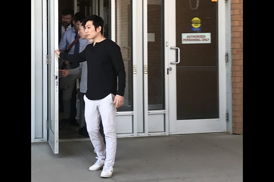 Brothers 33-year-old Jae Sung Lee and Jaeho Lee leave Saskatoon Provincial Court with their lawyers Monday.