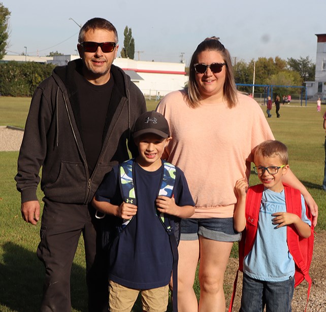 Wade Trach and Ashley Trach gave plenty of encouragement to their sons Braysen, left (Grade 3) and Graiden (Grade 1) before the start of the first day of school on Sept. 3 at CJES.