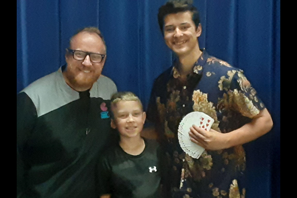 Putting on a special show for CCS students on June 2, from left, were: Hypnotist Corrie J, Corrie’s son Luca, and Magic Ben.