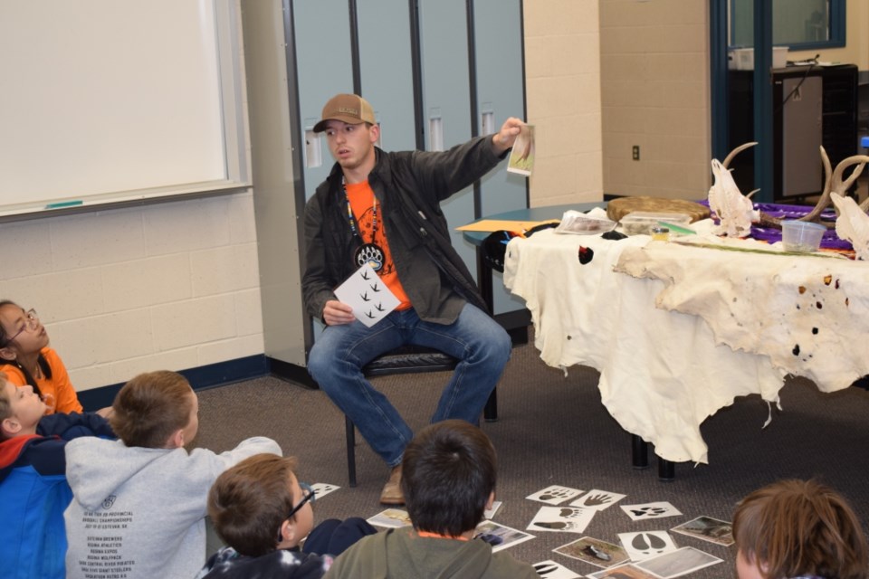 Parker Schmaltz talked to students about Indigenous artifacts. 