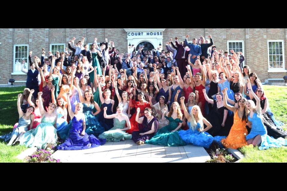 The Class of 2024 celebrates in front of the Estevan Court House. 