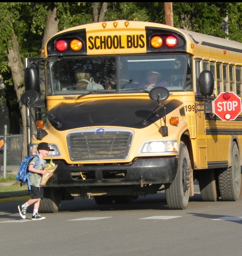 excited boy with flowers off bus resize