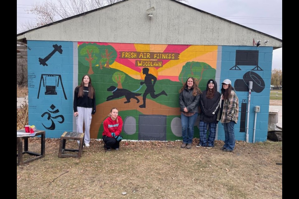 Two ECS classes, the all-girls PE 20/30 and art 20/30, created a mural at the Fresh Air Fitness outdoor gym. 