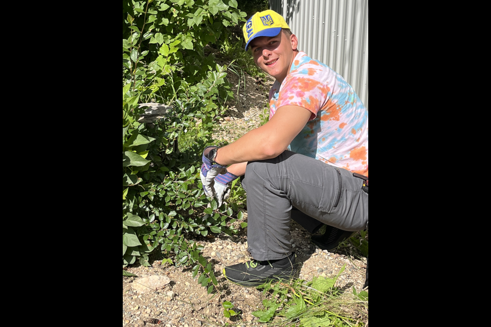 Dima Stepaniuk, Summer Camp Co-director for St. Michael's Ukrainian Catholic Church Camp of Madge Lake, helped lead cleanup activity at the Shrine of Our Lady of Lourdes Grotto in Rama on July 12 in preparation for the Rama pilgrimage.