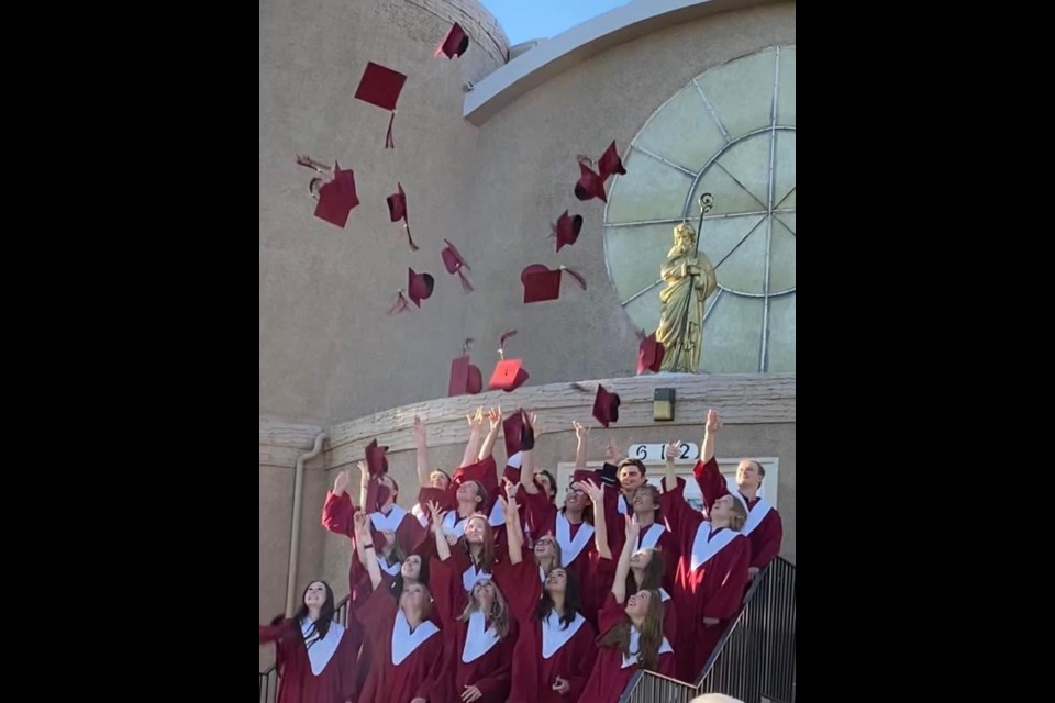 The traditional hat toss makes for a perfect picture with McLurg 2022 graduates.