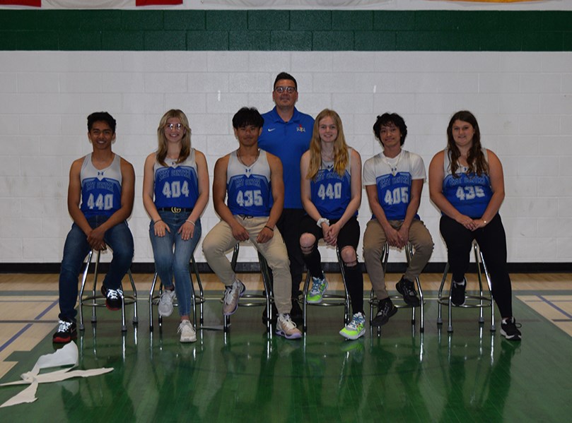 The Invermay School track-and-field team members for provincials, from left, were: (seated) Aron Cudal, Rachel, Enge, Lance Corpuz, Bailey Maier, Angelo Ferenal and Cassidy Bosovich; and (standing) Coach Kent Seerey. 