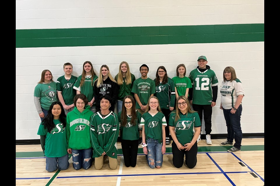 Brett Lauther (No. 12) of the Saskatchewan Roughriders visited Invermay School and spoke to the students about mental health and the Roughriders Reading Program.