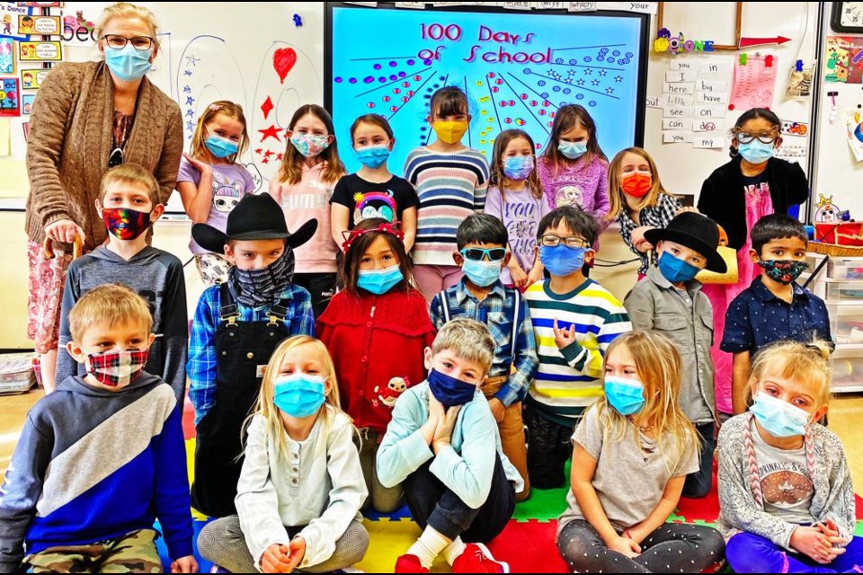 Grade 1 teacher Jennifer Woodard and her class gathered for the 100th day of school, and she and some of her students dressed up as how they might look at 100 years of age