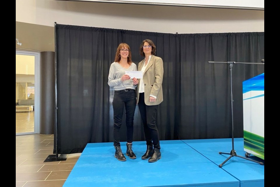 Mental Health and Addictions Counselling student Lydia Bruyere Hanson collects the Iyuhana Indigenous Bursary from Tania Andrist, executive director of the Centre of Sustainable Innovation. Estevan. 