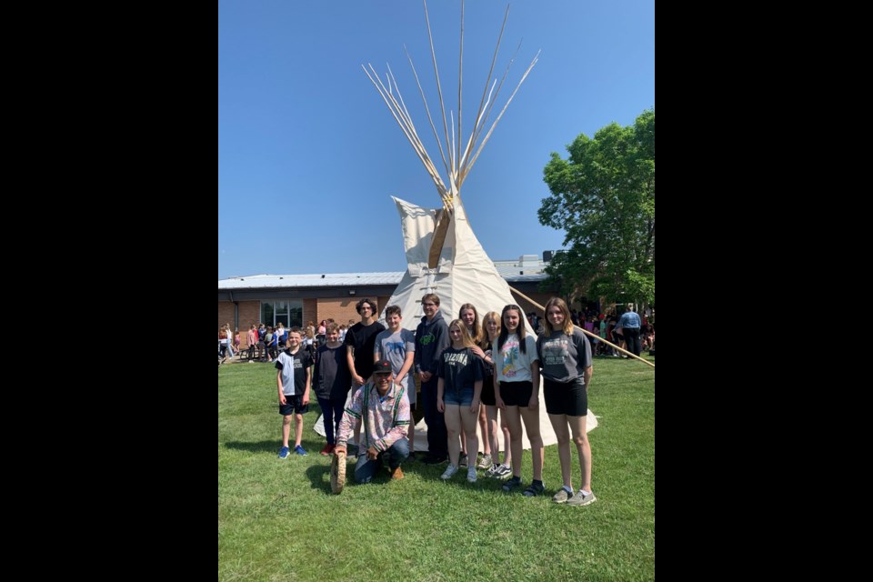 Sacred Heart students helped Lyndon Linklater with installing the new teepee on the school’s grounds.