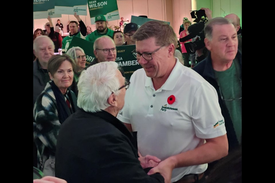 Scott Moe greets a supporter after making his speech.