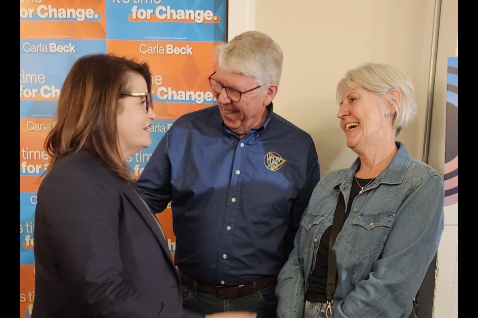 Saskatchewan NDP Leader Carla Beck, left, talks with some of their supporters after their campaign, even on Tuesday night, Oct. 1.