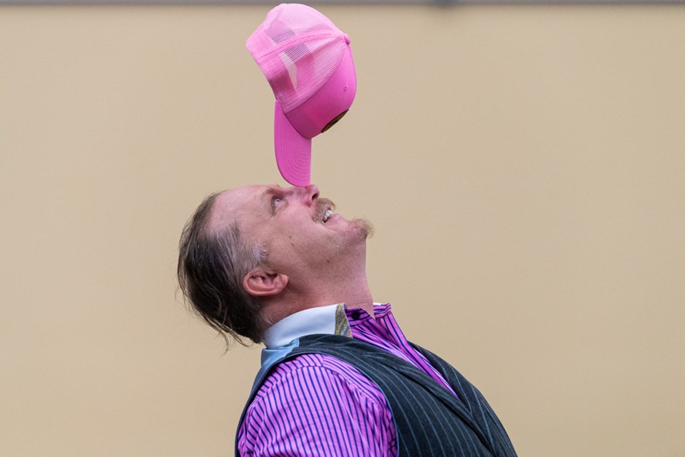 Dr. Von Houligan balances am audience member's hat on his nose. Allister Denton aka Dr. Von Houligan hails from Battleford and did his first magic trick performance in a church in Battleford when he was seven. He has been doing it ever since. Lately, he has been doing magic performances full time. 
* Please note these photos carry the photographer's copyright and may not be reproduced from this gallery. For print requests, visit https://www.mphocus.com/