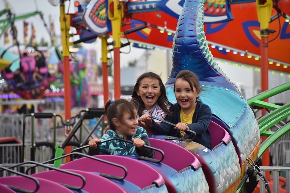 The Battleford's annual Northwest Territorial Days was a celebratory moment for these three children as they ended out the three day August event by riding the children's rollercoaster on the midway.