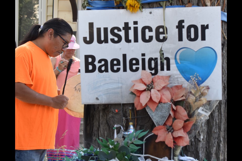 A drummer offers a song before the start of the memorial walk.