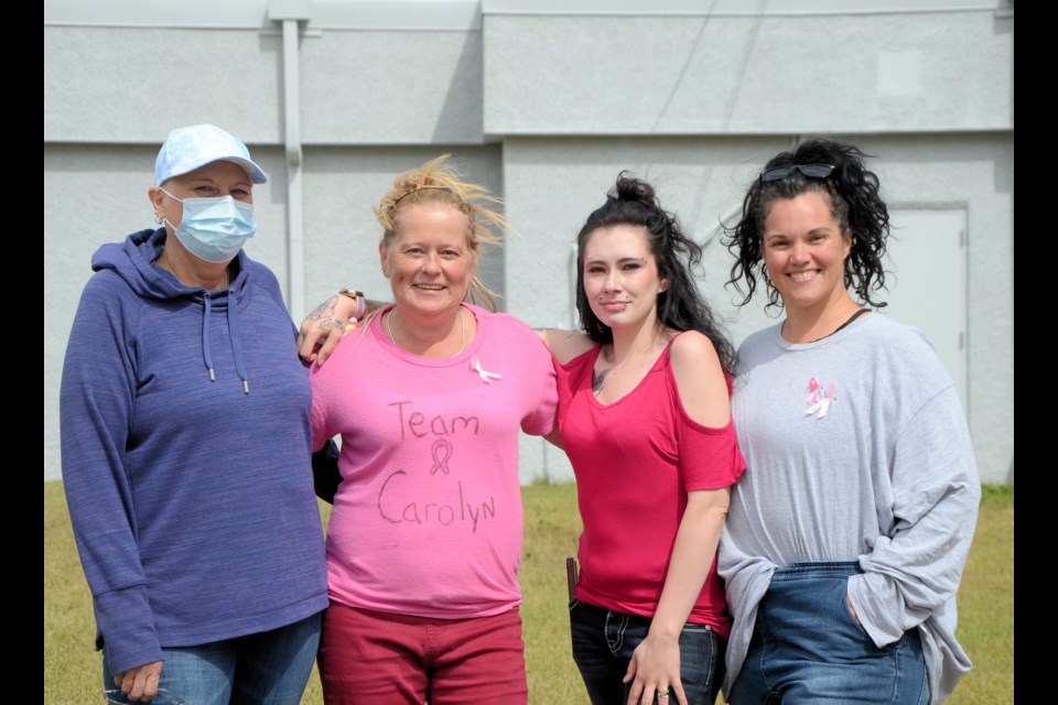 Breast cancer patient Carolyn Eremko poses with Wilkie CIBC staff Helen Urlacher, Dallas Harkins and Nadine LaGreca Crowe. Staff are raising funds to help Eremko with drug costs and for CIBC’s national Run for the Cure.