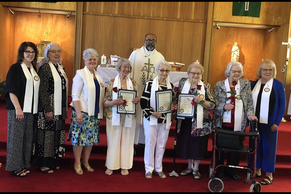 At the celebration of the 60th anniversary of the St. Joseph’s Catholic Women’s League charter signing, Joan Kowalyshyn, chairperson, and Liz Bahnuik, past president, presented special milestone pins to long-time members. From left, were: Kowalyshyn, Hélène Tremblay-Boyko (10 years), Adeline Leson (35 years), Julia Mazur (60 years), Sophie Fullawka (60 years), Evelyn Kuruliak (60 years), Anne Wyonzek (60 years), and Bahnuik. Behind the ladies is Father Joseph Kuruvilla, CWL Spiritual Director for the Canora branch. Unavailable for the photo was Arlene Lazaruk (35 years). 