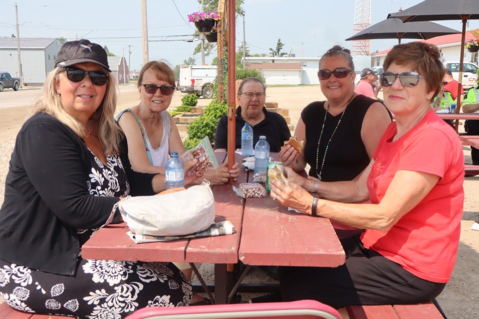 Sergey and Irene Skurat of Canora welcomed visitors from Victoria, B. C. and showed them some “fantastic” Canora hospitality at the 13U Canora Reds provincial baseball team fundraiser barbecue on July 10. From left, were: Marina Pittroff, Lesley Gentry, Sergei, Liz Condon and Irene. 