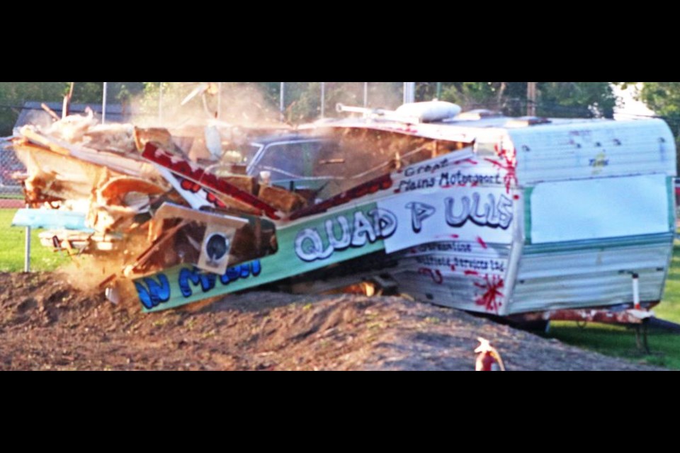 A car painted in Rider green, driven by Tyler Metheral, smashed through this camper as part of the finale at the Weyburn Fair on Saturday evening - and to ensure the job was fully done, he drove the car through the camper three times.