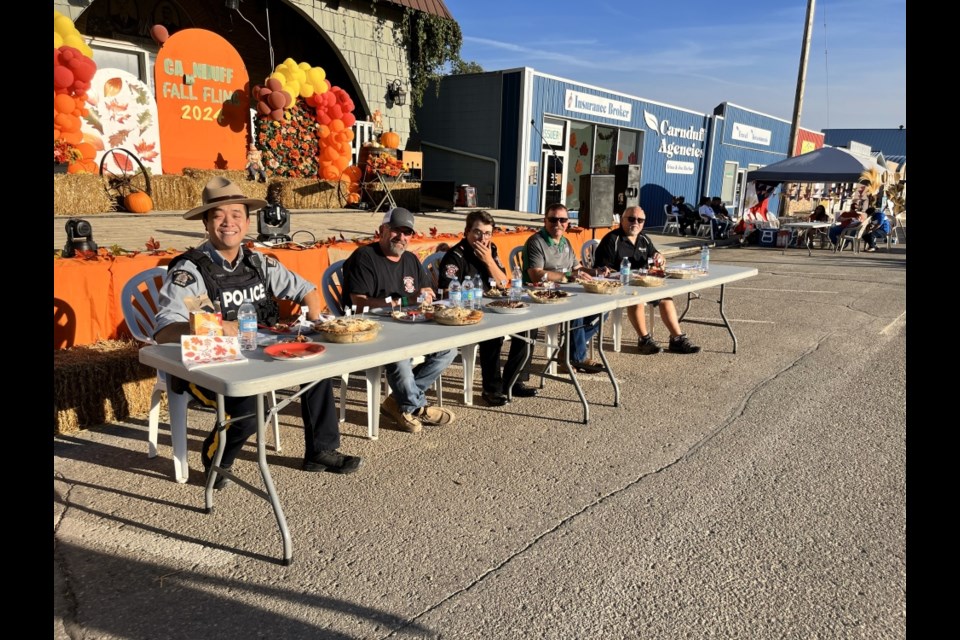 From left, Const. Calvin Tsang, deputy reeve Clint Paton, firefighter Alex Belke, Cannington MLA Daryl Harrison and Mayor Ross Apperely sampled homemade pies to declare the winners. 