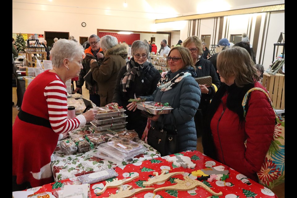 At the Last Christmas Market in Canora’s Rainbow Hall on Dec. 14, Del Palagian, in her festive red and white outfit, was looking after a lineup of shoppers interested in her baking, including: tarts, fruit cake, cabbage rolls, perishke, Nalynsky and pies.