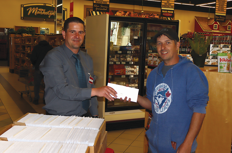 During Co-op Equity Days on May 21 at the Food Store in Canora, Brad Kaye (right) received his equity cheque from Gateway Co-op General Manager Brad Chambers. “As s result of our tremendous member support the Gateway Co-op had another successful year,” stated a release. “This success has permitted the Board of Directors to authorize an allocation of over $1,021,000 to its members. Each member is credited with an allocation based on their purchases. The allocation is a percentage of your purchases that ranges anywhere from 0.5 per cent to six per cent.”  