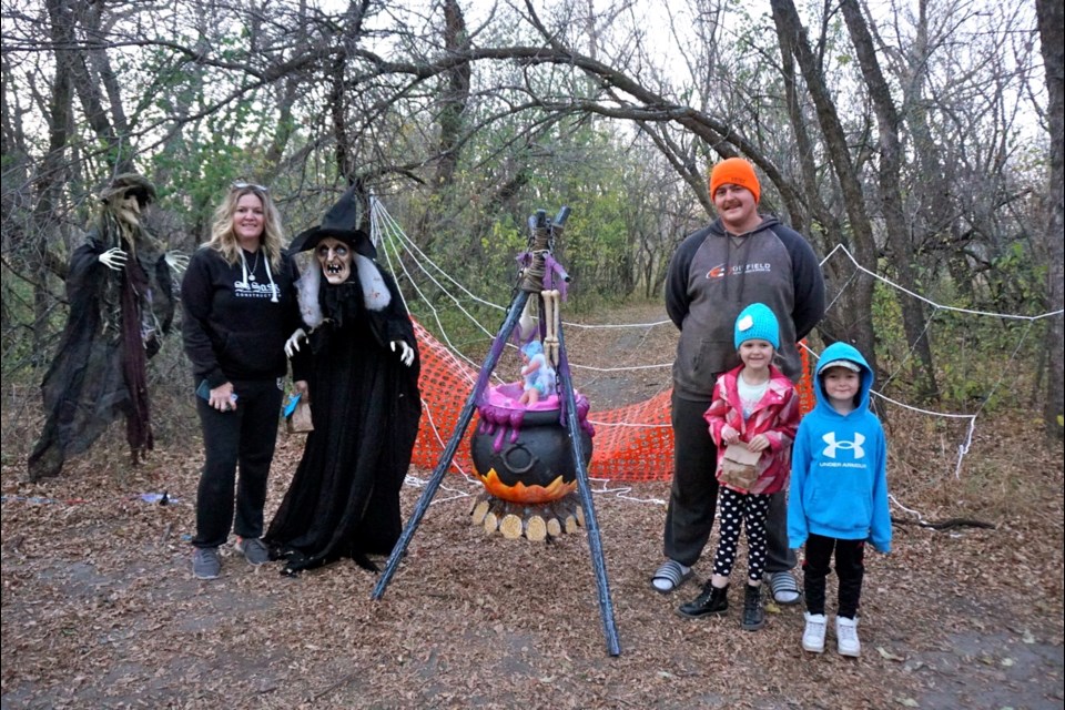 Saige and Scarlett Christenson and Lincoln and Leanne Volesky experienced the Trail of Terror on Friday. 