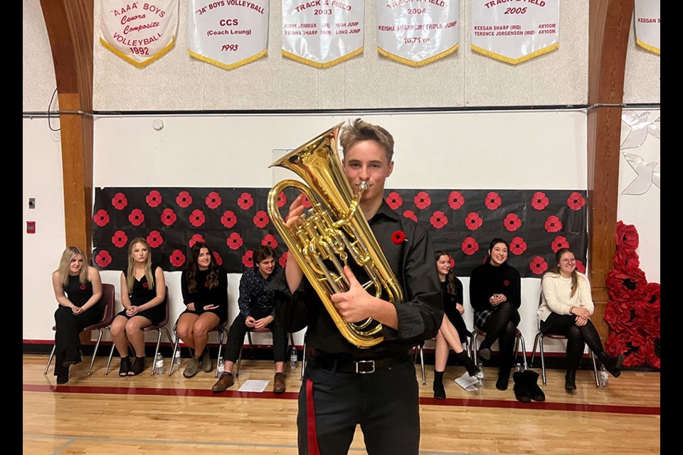 Jack Craig played The Last Post during the Canora Composite School Remembrance Day service on Nov. 9. The students sitting in the background, from left, were: Jordan Harper, Shayna Leson, Ava Love, Ty Sleeva, Delilah Wilson, Bailee Zuravloff, and Callie Sznerch.