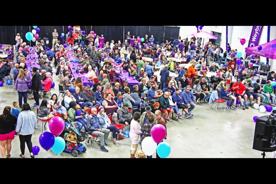 The Weyburn Exhibition Hall was filled with many residents, families and community group representatives for the Weyburn Credit Union's BBQ, concert with Brayden King and community grant announcements on June 27.