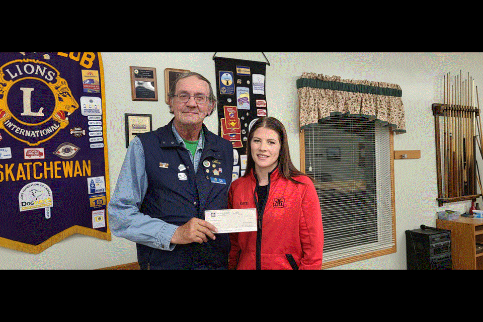 Carlyle District Lions Club president Craig Savill accepts a cheque for $500 from Carlyle Home Hardware owner Katie Gavelin for the bike rodeo that was held Sept. 12. Fifty-six helmets were given to children from kindergarten to Grade 2 from the Carlyle Elementary and Manor Schools. This event will be held again next year.