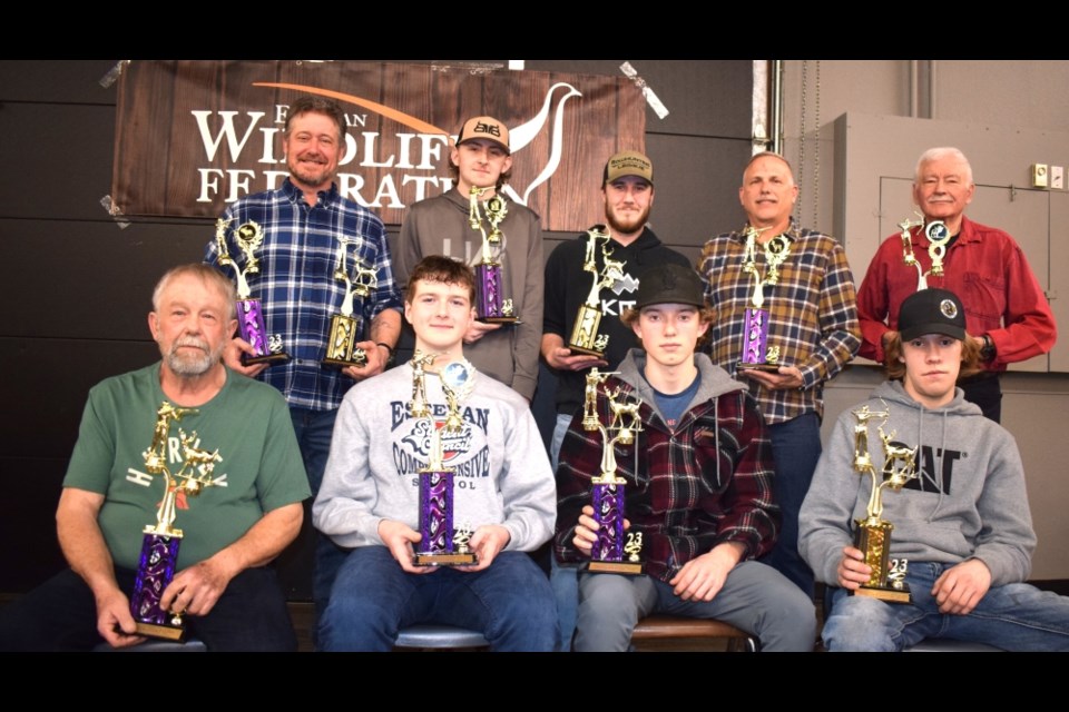 Men's rifle and archery award winners were back row, from left, Kelly Pastachak, Brady Plummer, Cameron Donovan, Perry Holmgren and Jerry Michalski. Front row, Blaine Stropko, Vaughn Bourassa, Brady Katsantonis and Jayden Van De Woestyne. 