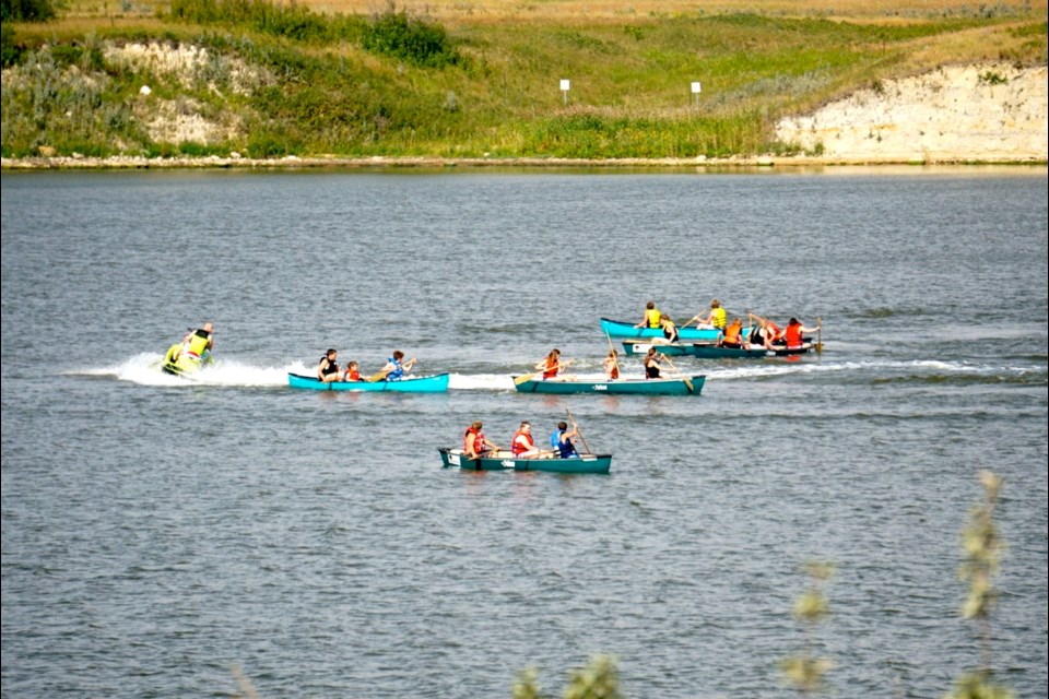 Conservation camp participants learned how to recover a canoe if it tips on the water. 